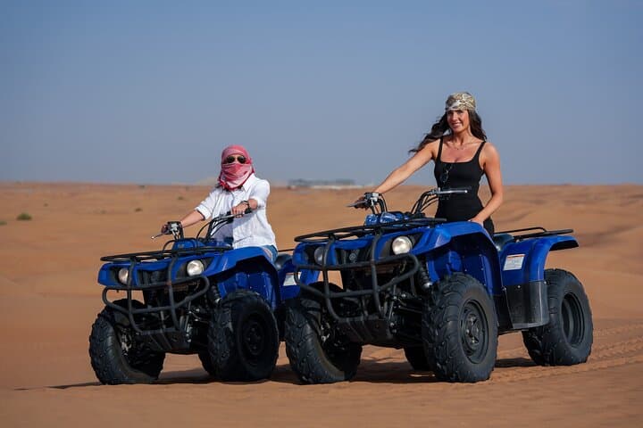 Premium Dubai Red Dunes Quad Bike Tour, Sandboard, Camel & BBQ