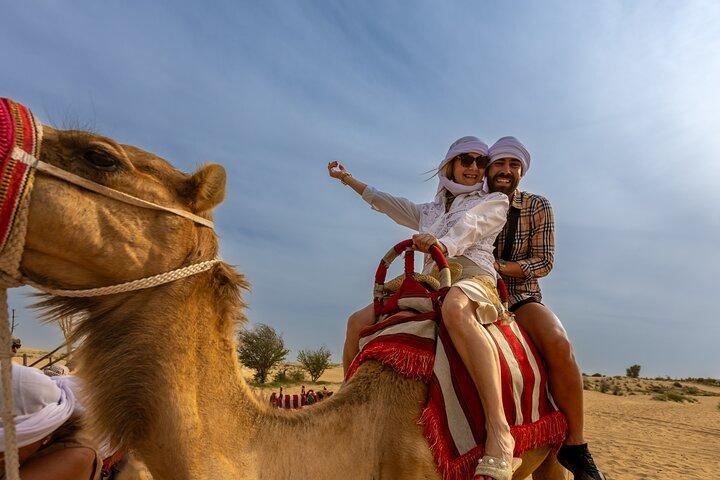 Dubai: Quad Bike Tour with Camel Ride, Sand Boarding & BBQ