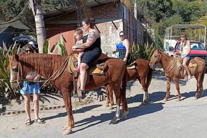 Passeggiata a cavallo a Stone Island sulla spiaggia