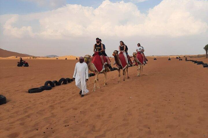 Dubai Desert Safari with Quad Biking Camel Riding and BBQ Dinner